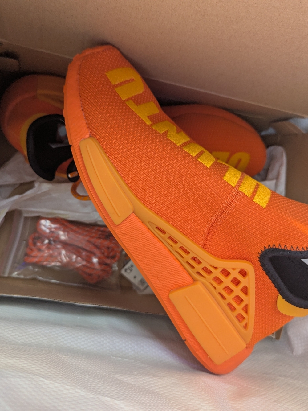 adidas x Pharrell Williams - HU NMD Orange / Bright Orange / Core Black Low Top